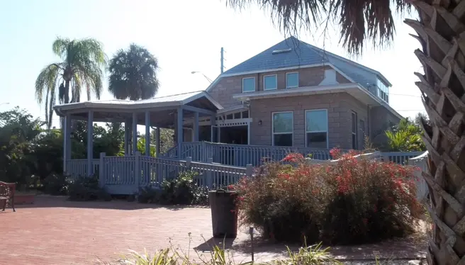 On-site computer repair in Palm Harbor, FL with a local coastal neighborhood backdrop